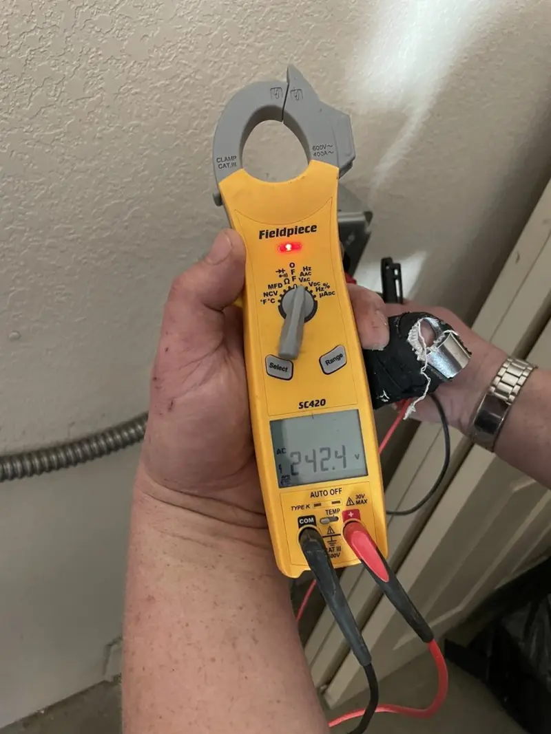 Voltage testing with clamp meter during Recessed Lighting Installation in Pekin